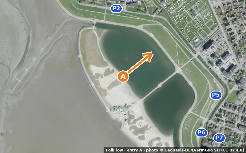 Aerial photo of entry A at Büsum (Wattenmeer): the arrow points onto the water, P = car parks
