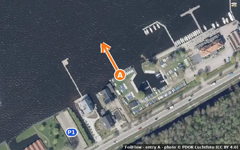 Aerial photo of entry A at Haren: the arrow points onto the water, P = car parks