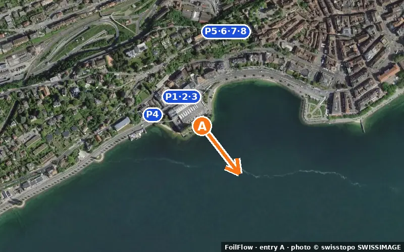 Aerial photo of entry A at Hauterive (Lac de Neuchâtel): the arrow points onto the water, P = car parks