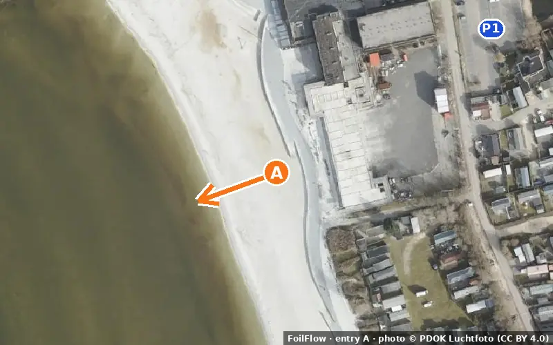 Aerial photo of entry A at Makkum: the arrow points onto the water, P = car parks