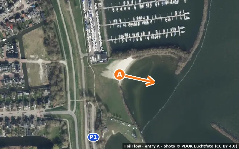 Aerial photo of entry A at Medemblik: the arrow points onto the water, P = car parks