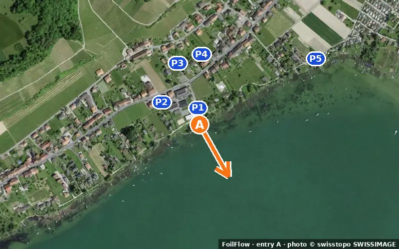 Aerial photo of entry A at Nant (Murtensee): the arrow points onto the water, P = car parks