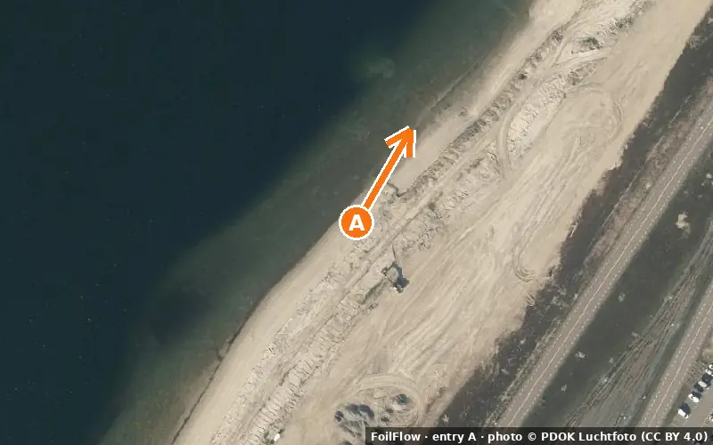 Aerial photo of entry A at Rotterdam (sea): the arrow points onto the water, P = car parks