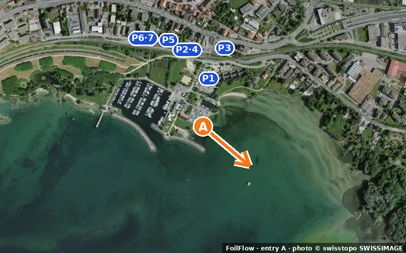 Aerial photo of entry A at Saint-Blaise (Lac de Neuchâtel): the arrow points onto the water, P = car parks