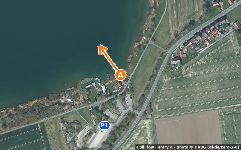 Aerial photo of entry A at Singlis (Singliser See): the arrow points onto the water, P = car parks