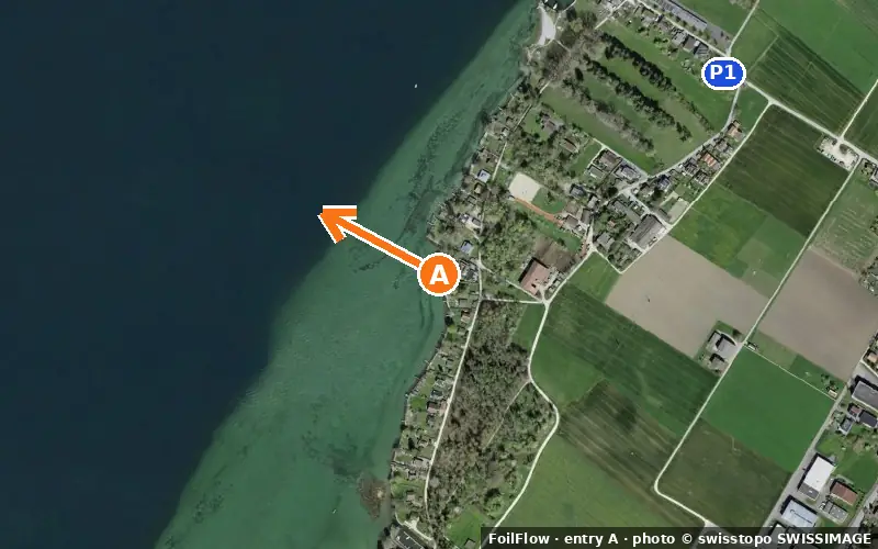Aerial photo of entry A at Sutz-Lattrigen (Bielersee): the arrow points onto the water, P = car parks